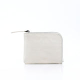 hmny's compact wallet in light grey on a white background