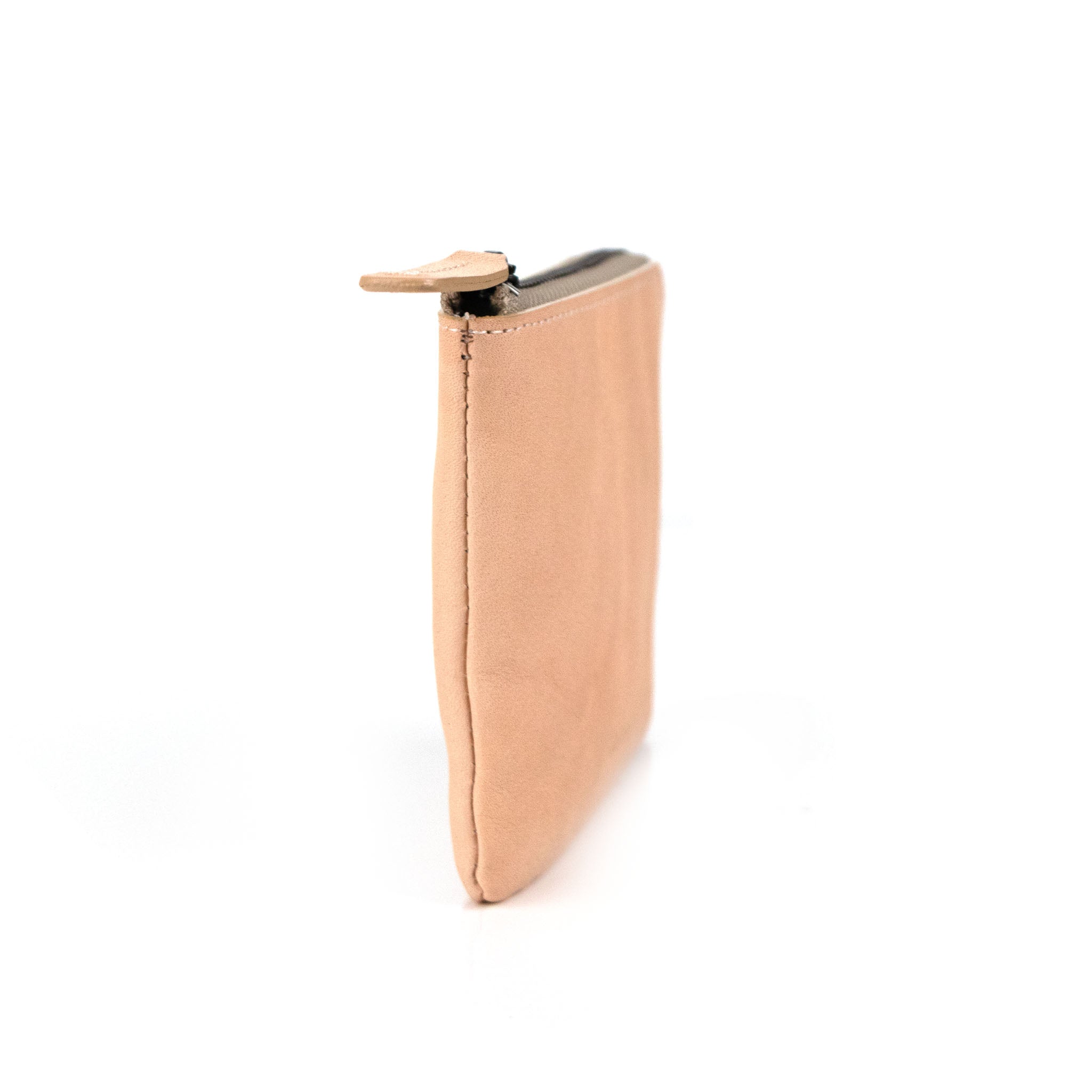 Side view of  hmny's compact wallet in natural on a white background