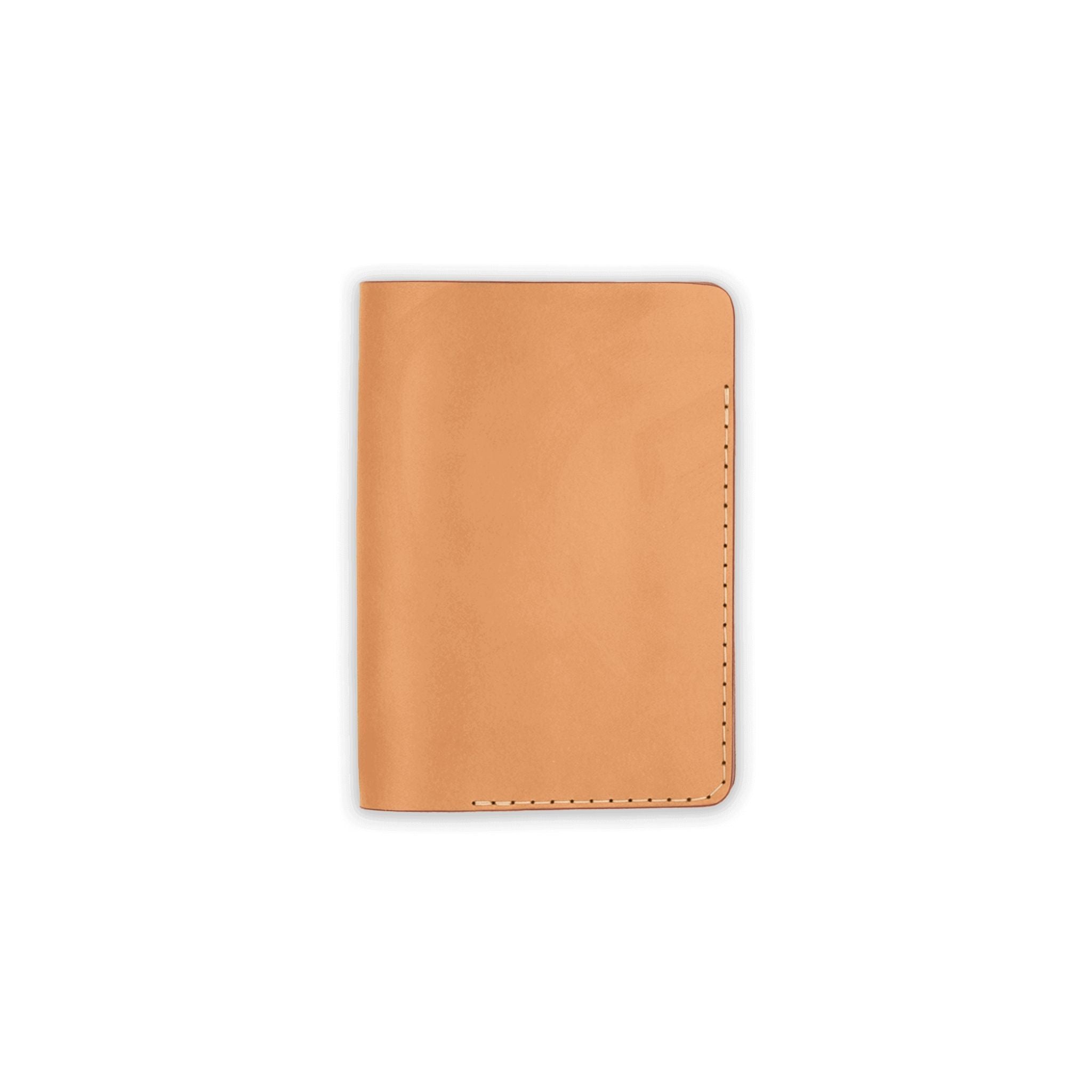 Tan leather passport cover on a white background