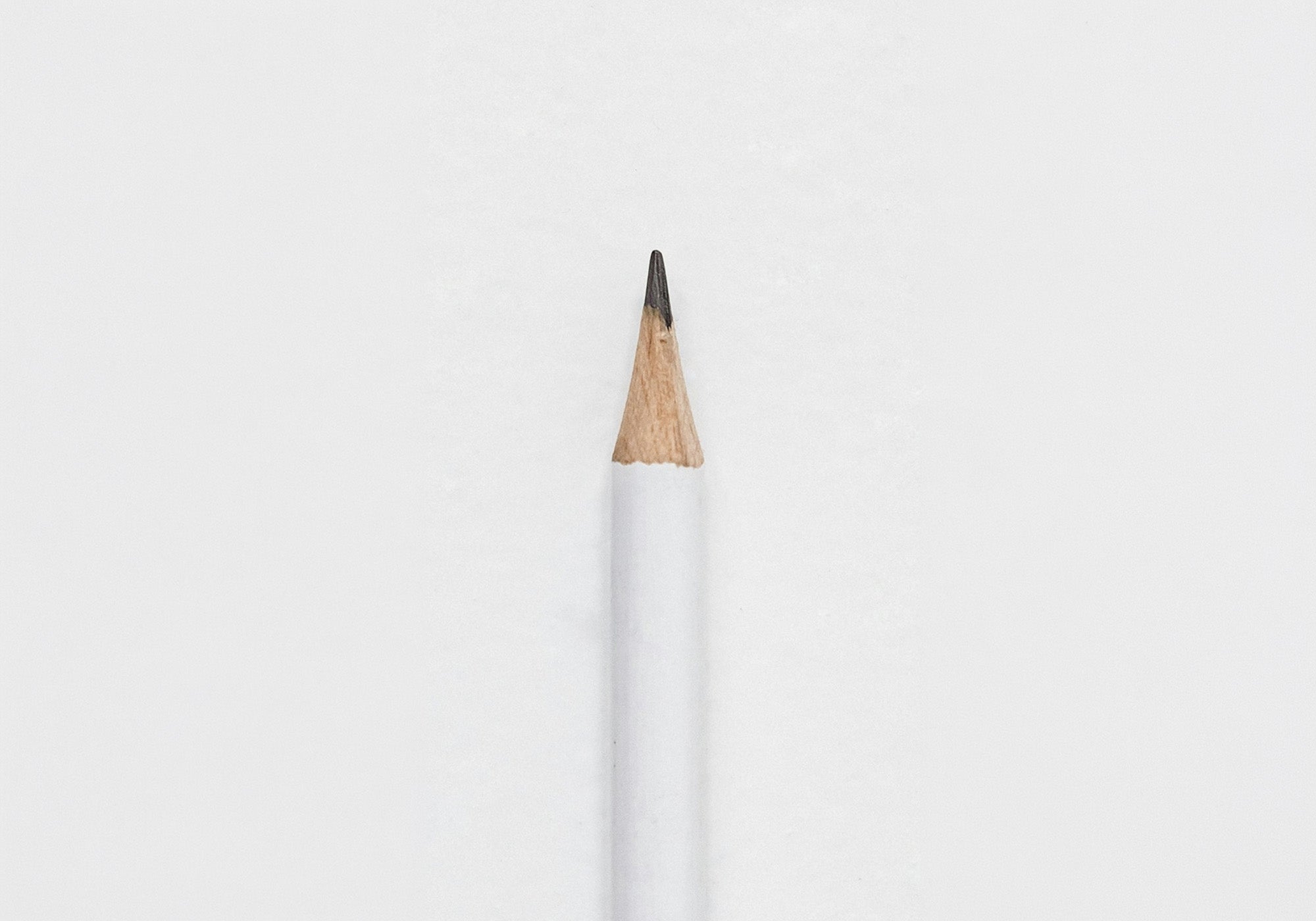 Image of a white pencil on a white background