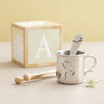 lifestyle image of beehive silver babycup with elephant design and spoon with elephant design 