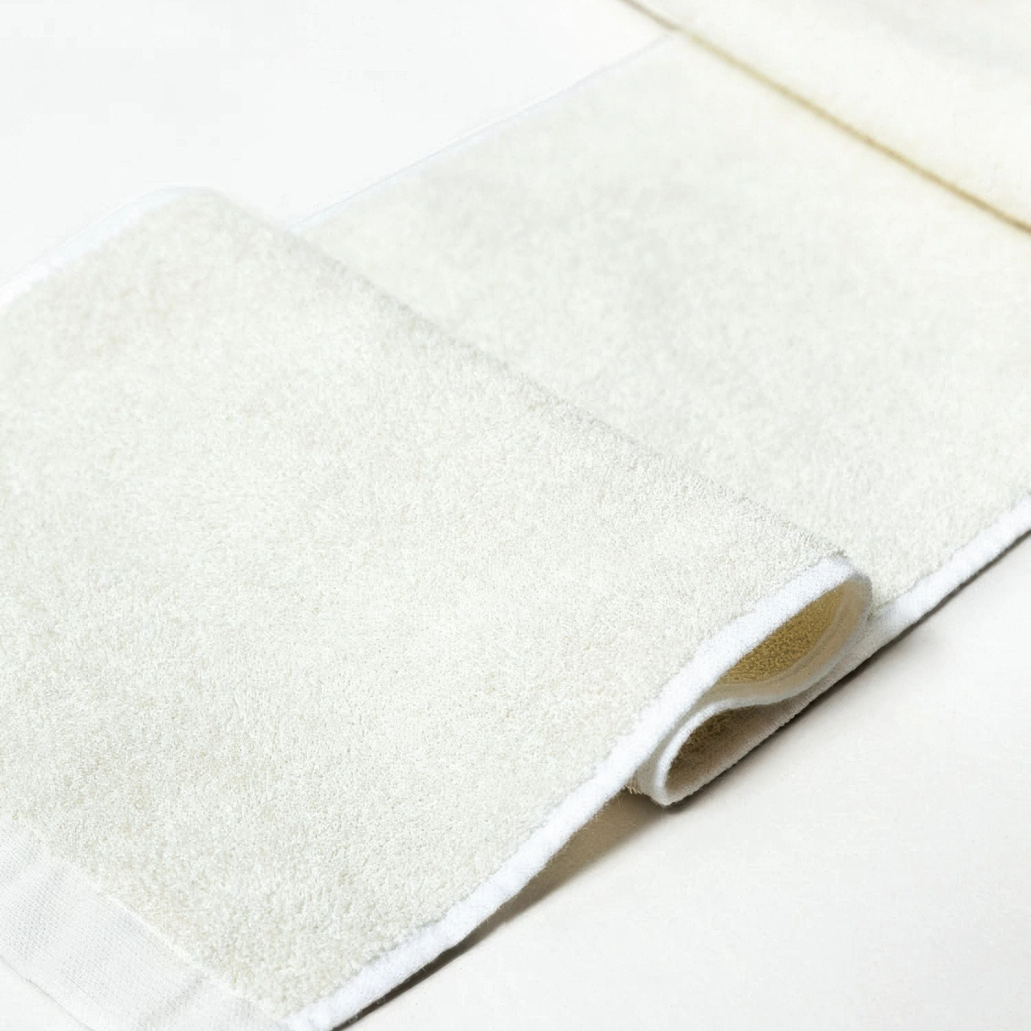 Sasawashi body scrub towel on a warm background
