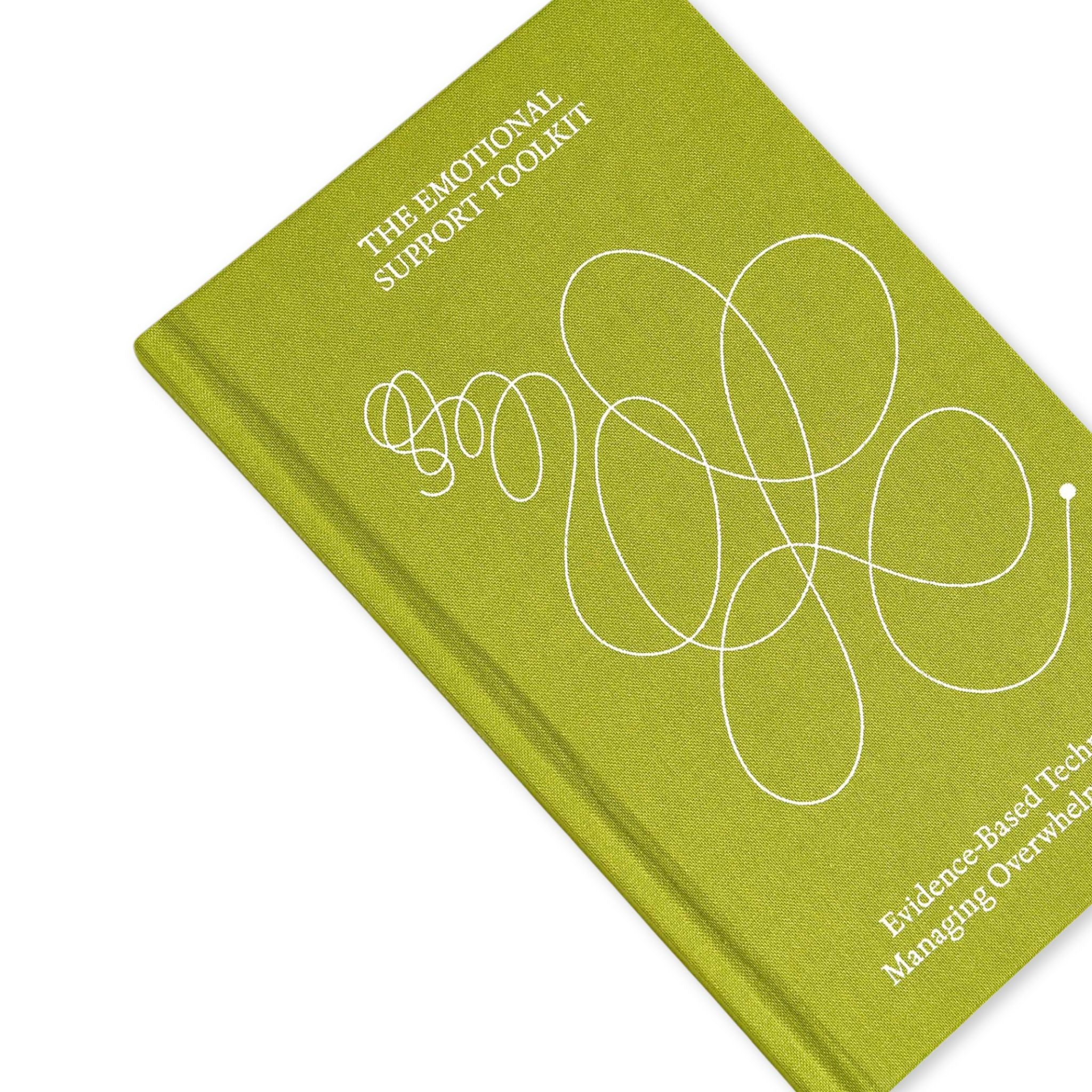 Green notebook titled 'The Emotional Support Toolkit' on a white background