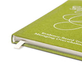 Green notebook titled 'The Emotional Support Toolkit' on a white background