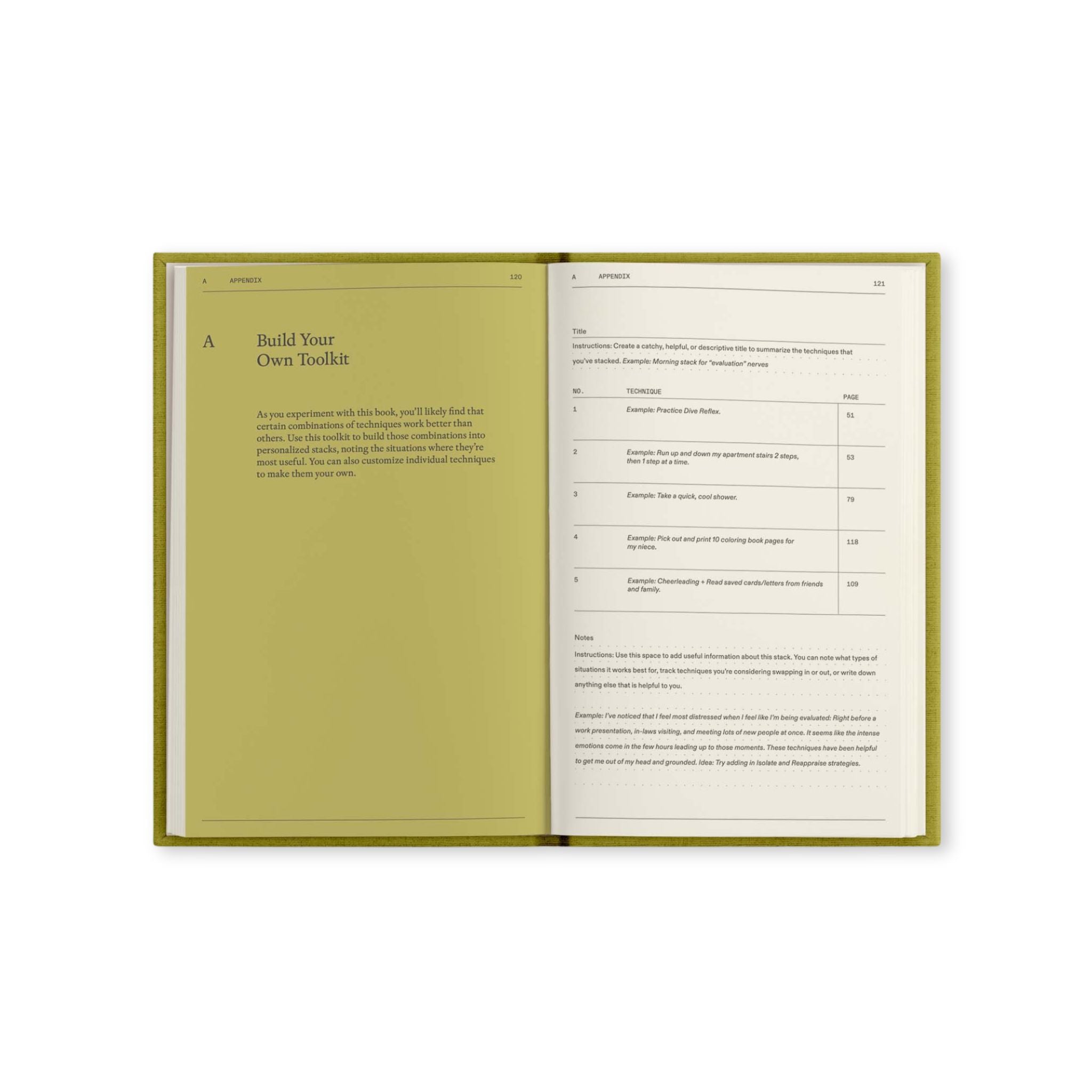 Open notebook with green cover and white pages on a white background