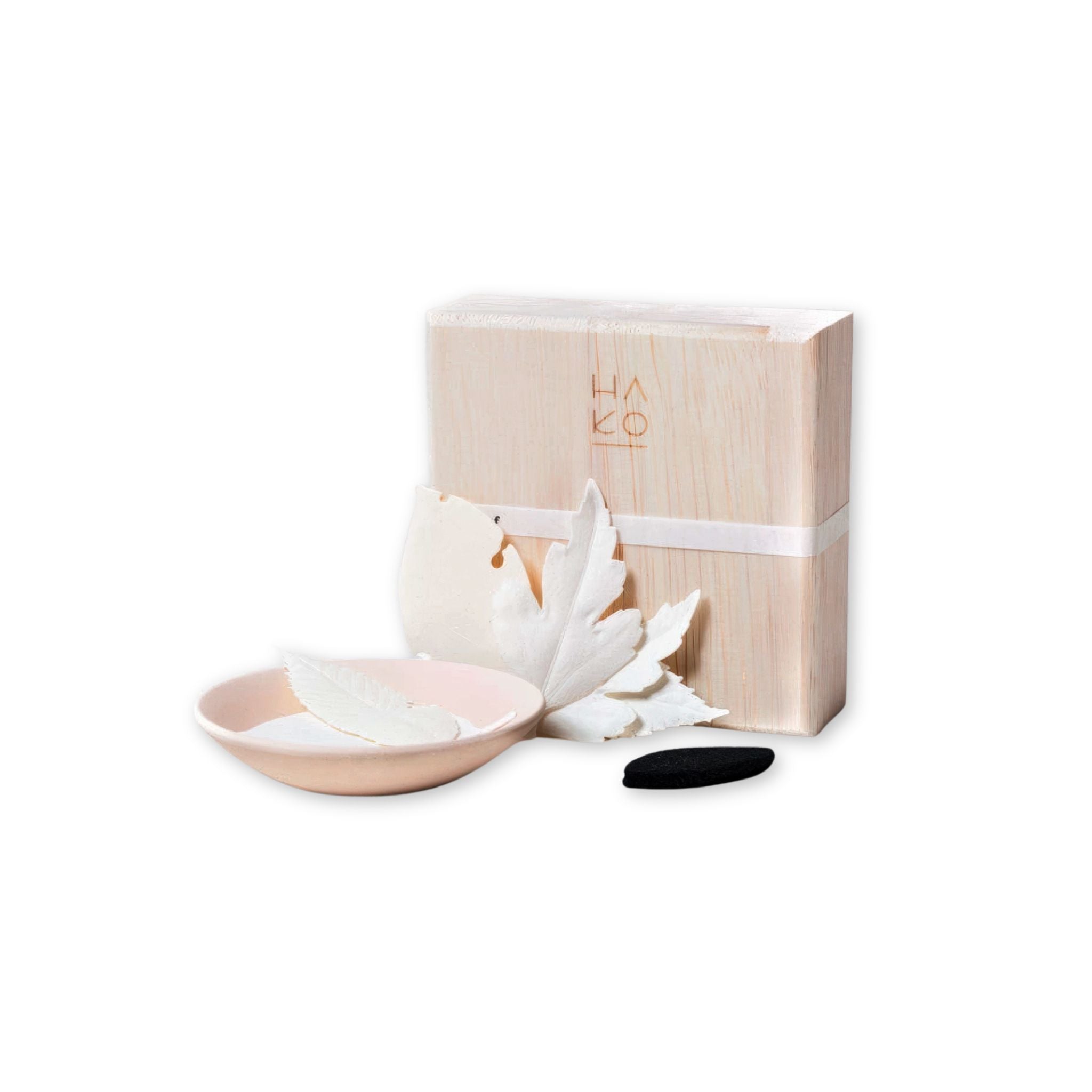 Ha Ko incense kit with a wooden box, ceramic bowl, and white flowers on a white background
