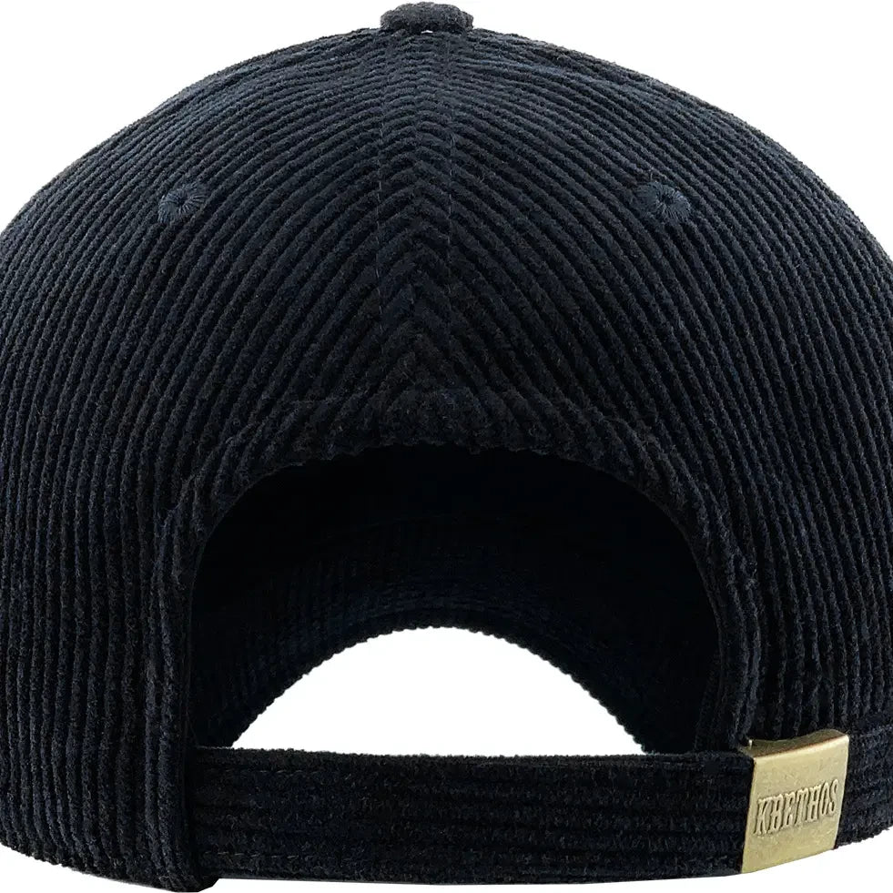 Back view of black corduroy cap with a gold tag on a white background