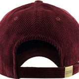 Back view of burgundy corduroy cap with a gold tag on a white background