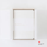Minimalist iA notebook for writers with a wooden box on a white background, featuring the Red Dot Award logo.