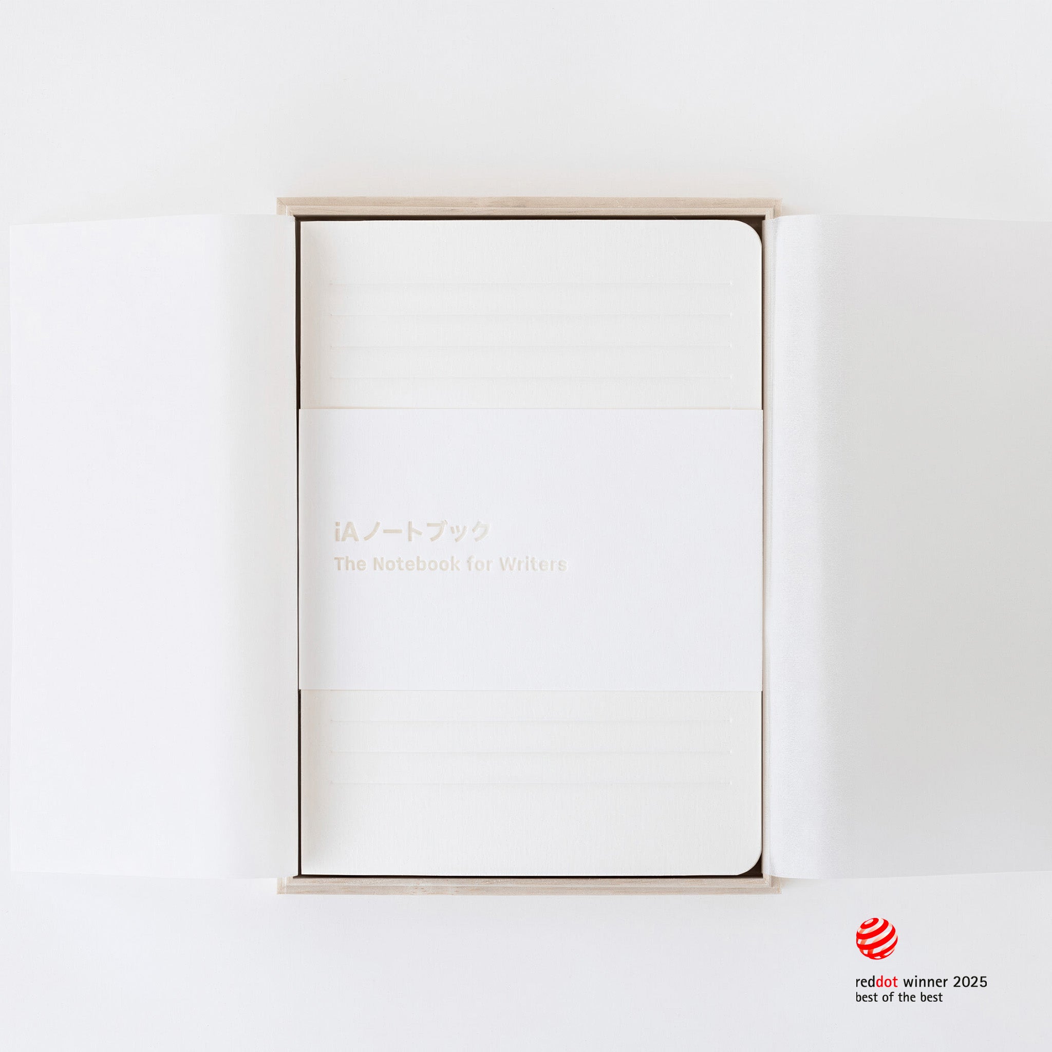 Minimalist iA notebook for writers with a wooden box on a white background, featuring the Red Dot Award logo.
