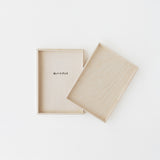 Minimalist iA notebook for writers' wooden box on a white background, 