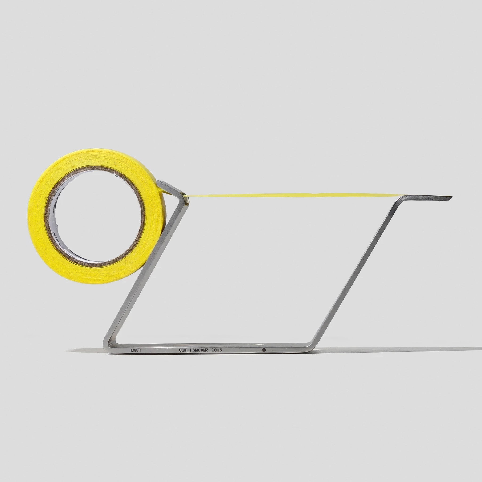 Side view of the Multi Radius Tape Holder holding a roll of yellow tape