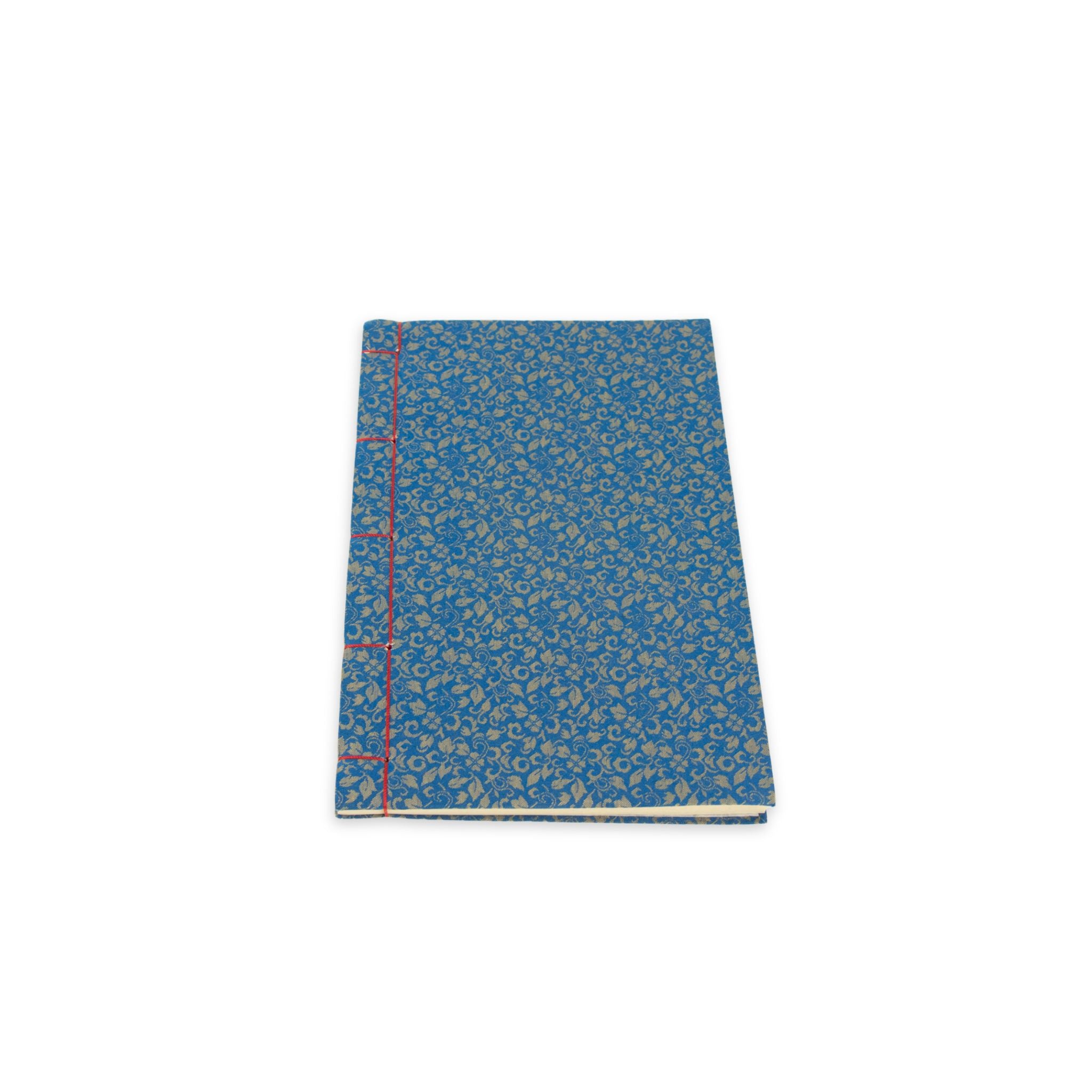 Blue notebook with red stitching on a white background