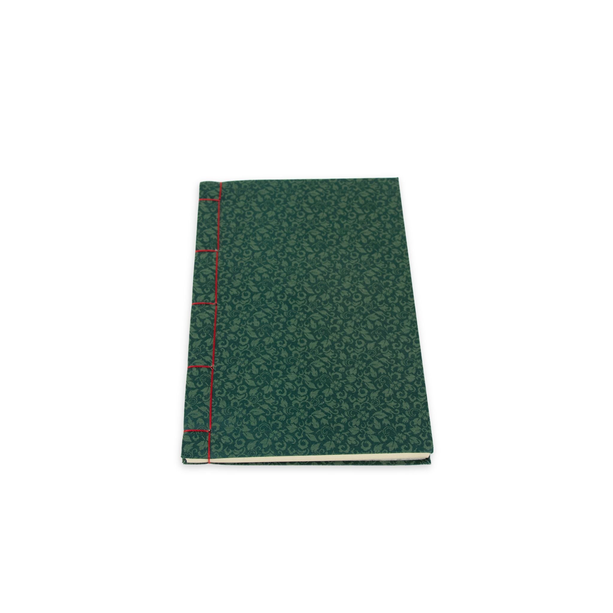 Green notebook with red spine on a white background