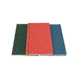 Three notebooks with different colored covers on a white background