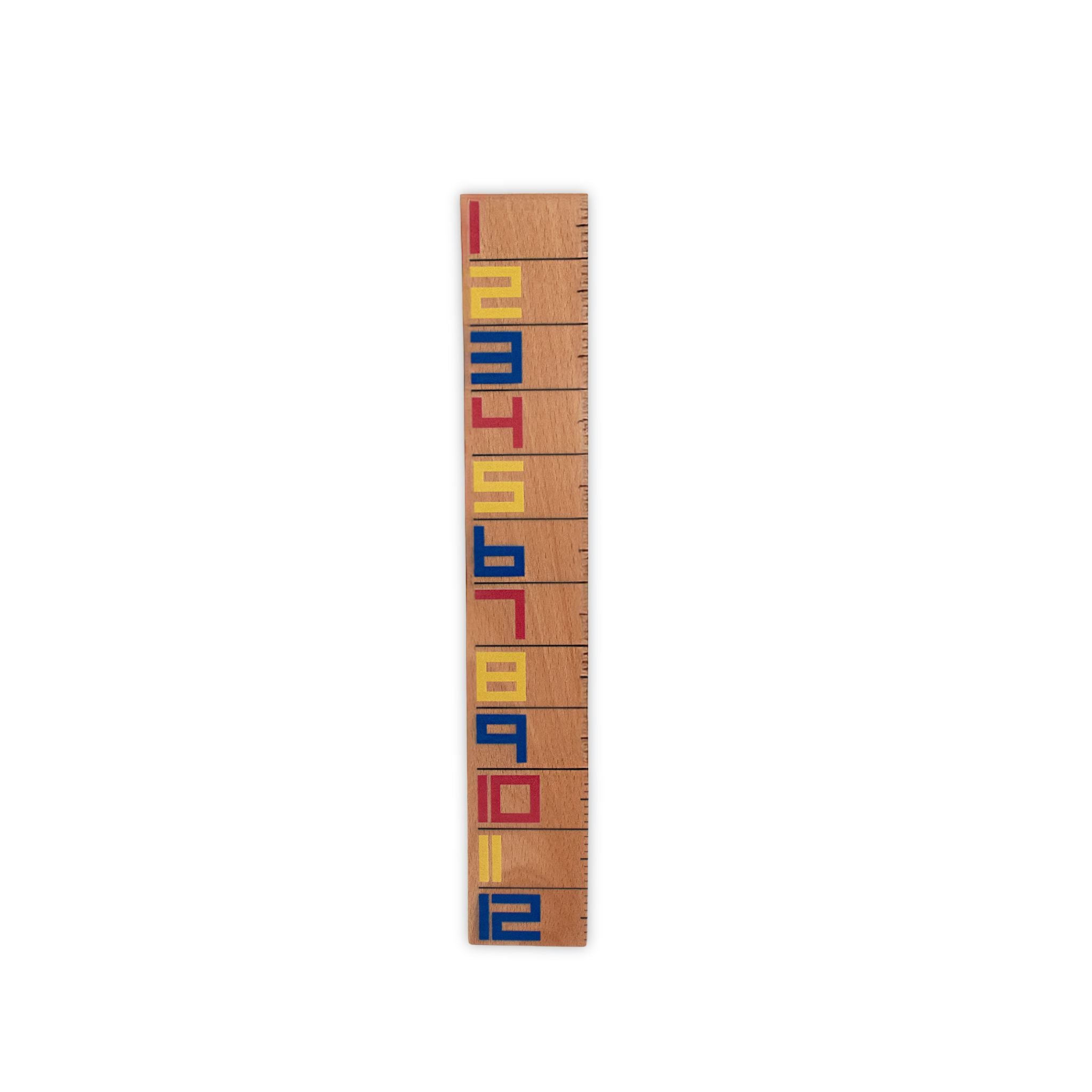 Wooden De Stilj ruler with colorful letters on a white background