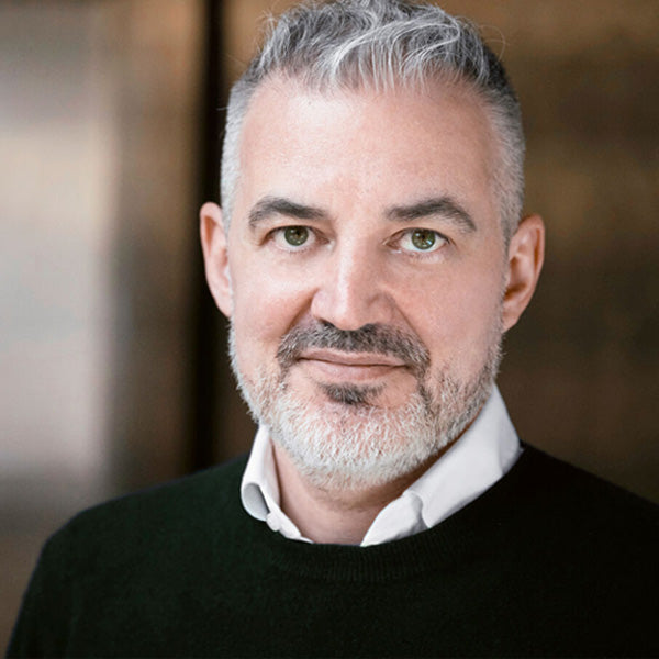 A profile photo of Oliver Reichenstein, founder of iA