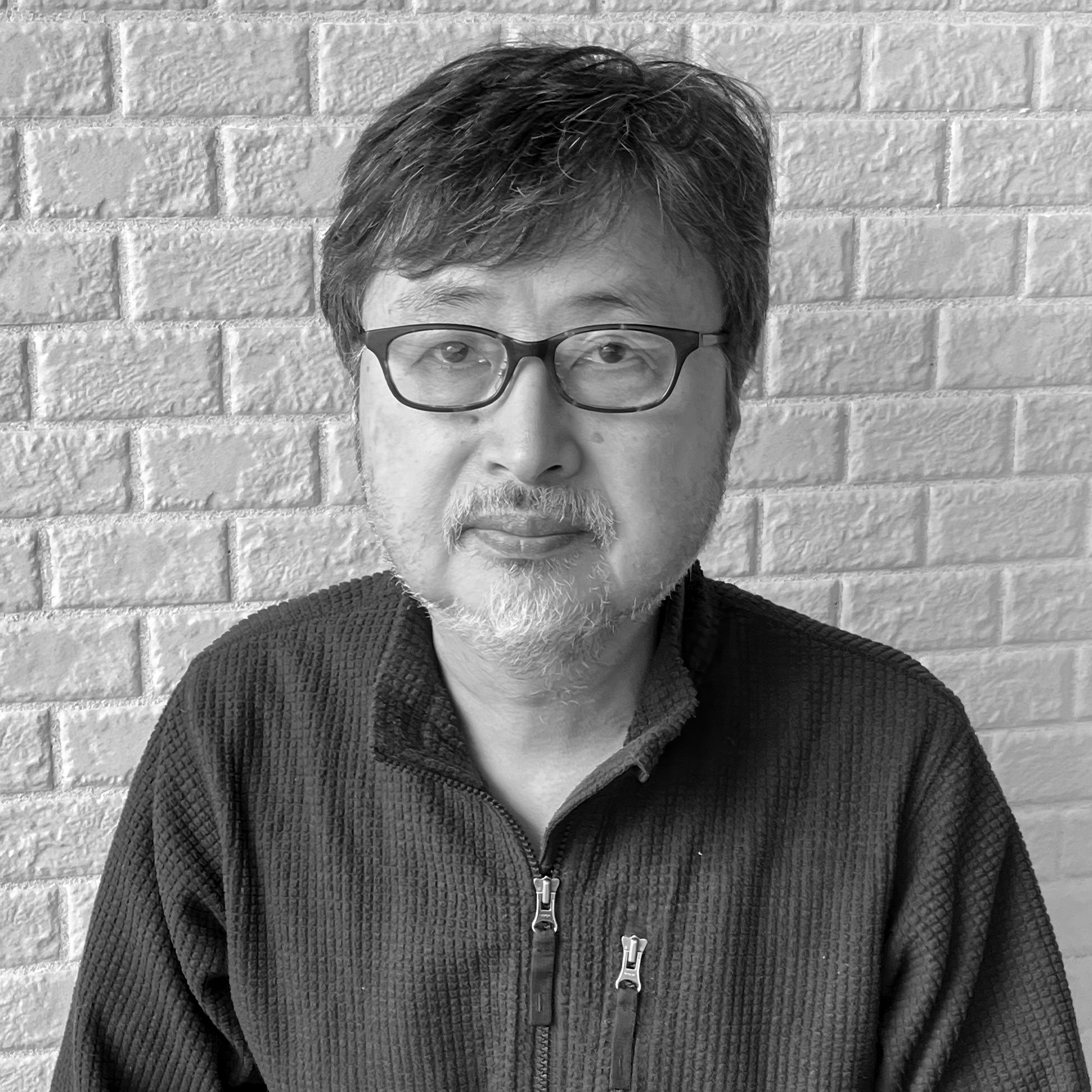 Black and white profile picture of designer Shuji Miyamoto