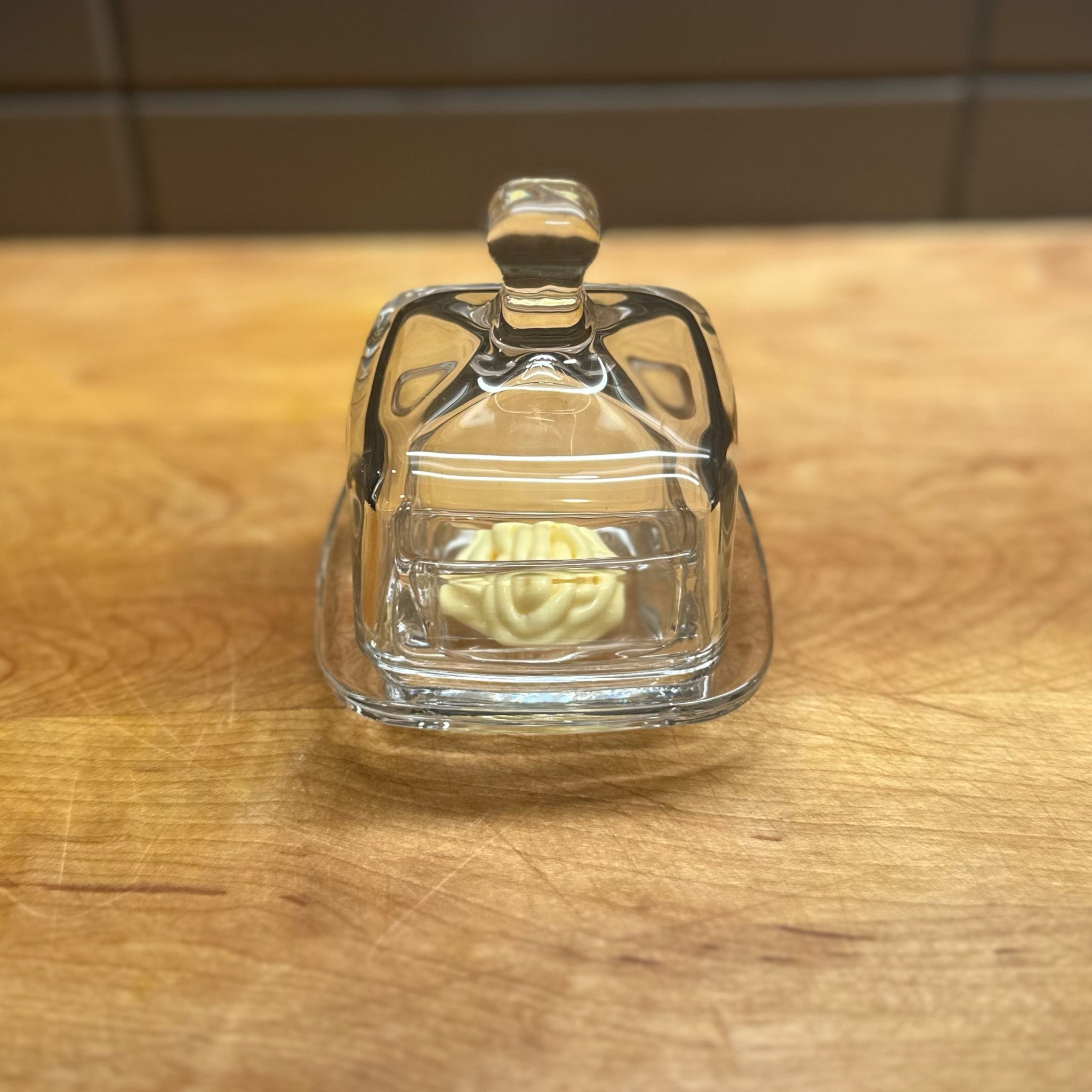Image of Earth & Nest's Cloche square condiment glass container on a wooden cutting board with mayonnaise.