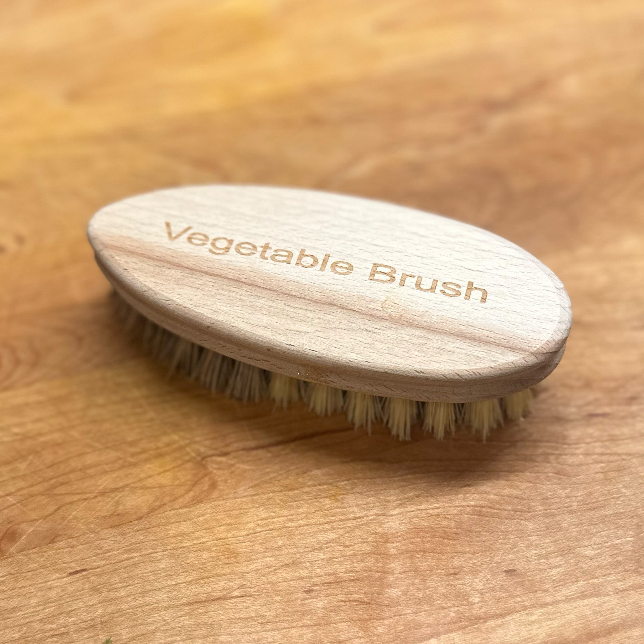 Top view of Vegetable Brush on wood surface