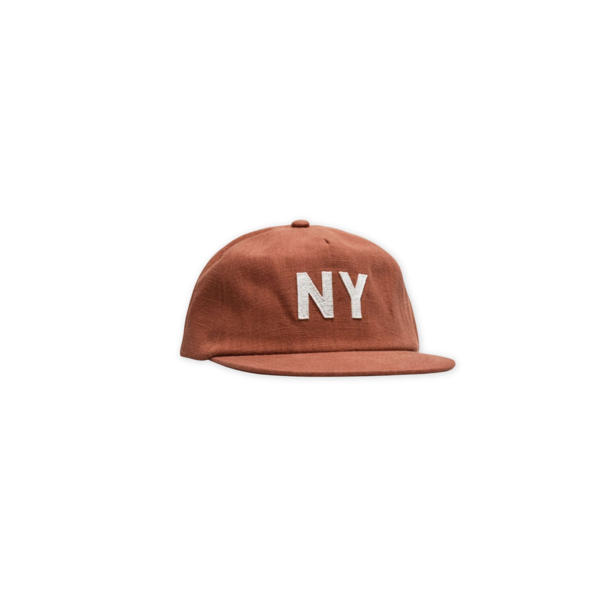 Front angled view of the linen NY hat in clay