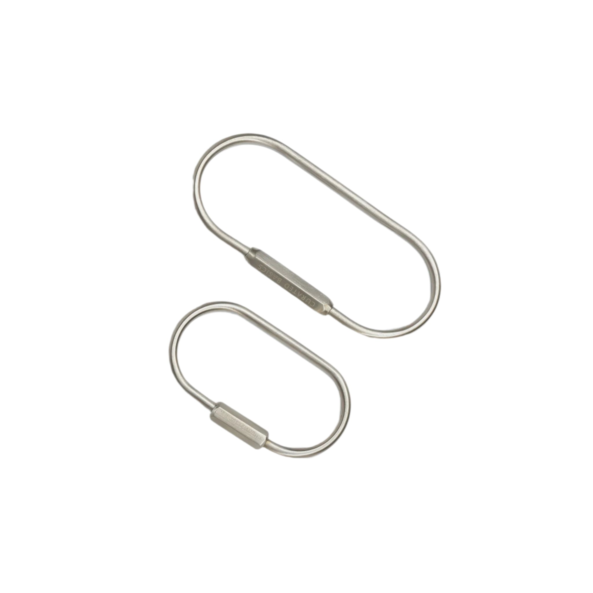 Side by side top view of the O Key Ring in steel in sizes small and large