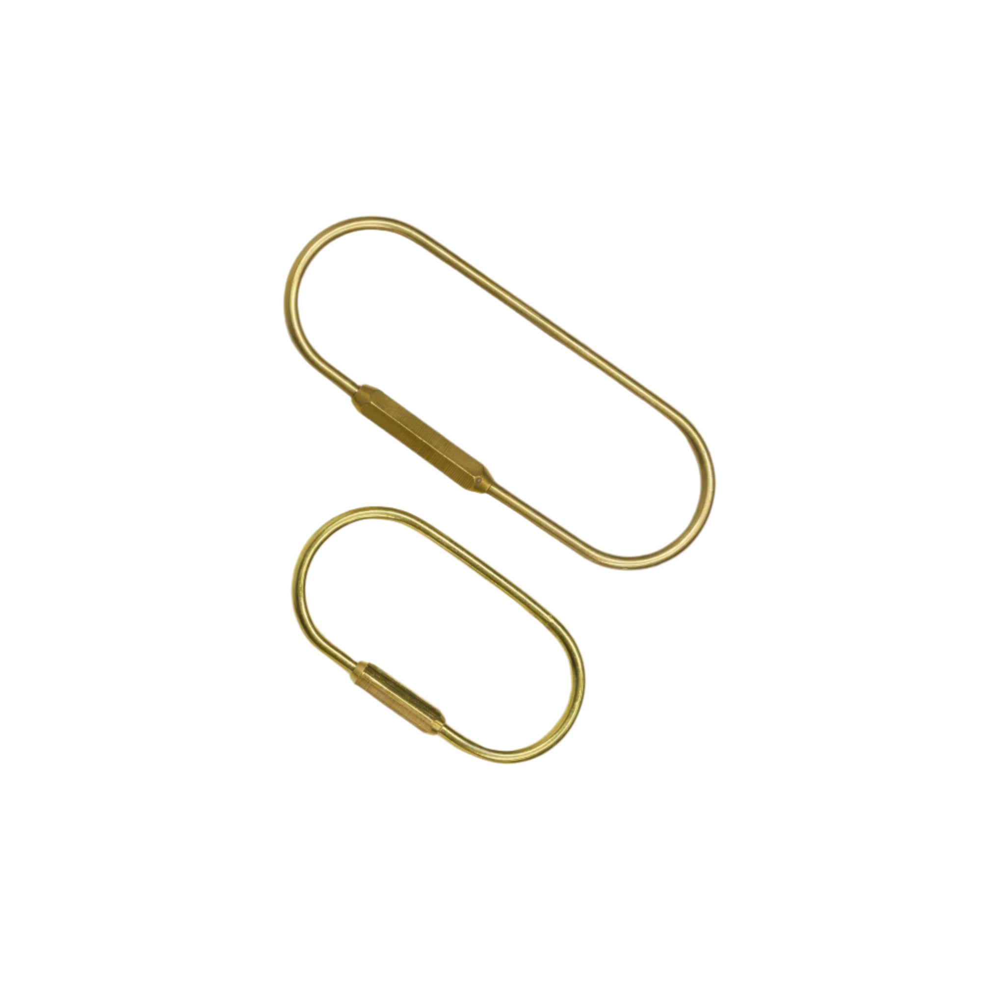 Side by side top view of the O Key Ring in brass in sizes small and large