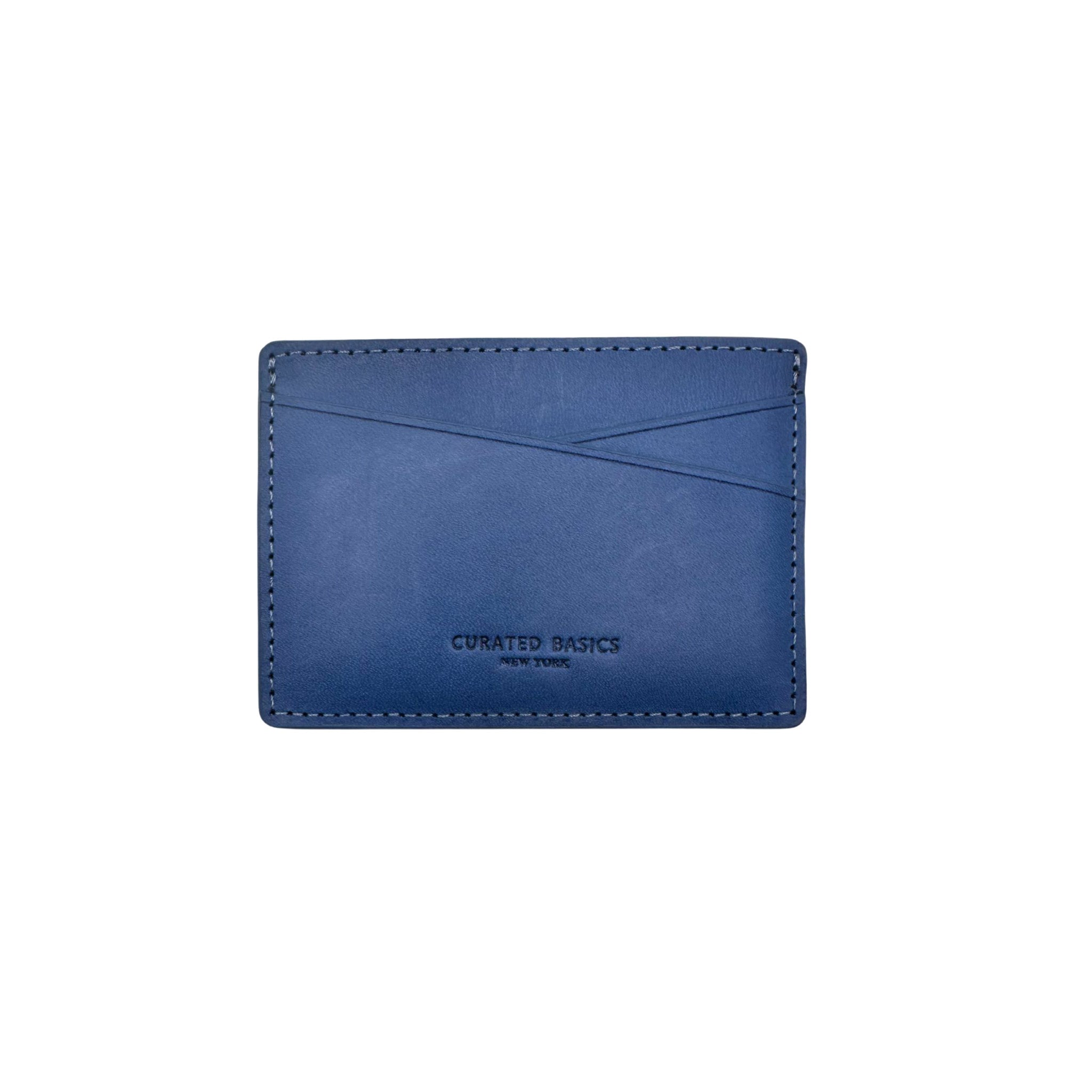 Front image of the navy leather card holder by Curated Basics 
