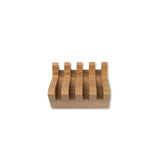 Slanted wooden soap dish on a white background