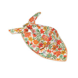 Floral patterned scarf on a white background with orange and light green colors prominent