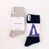 Two pairs of socks with packaging on a white background