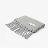 Folded grey scarf with fringes and branded logo Arctic Fox on a white background