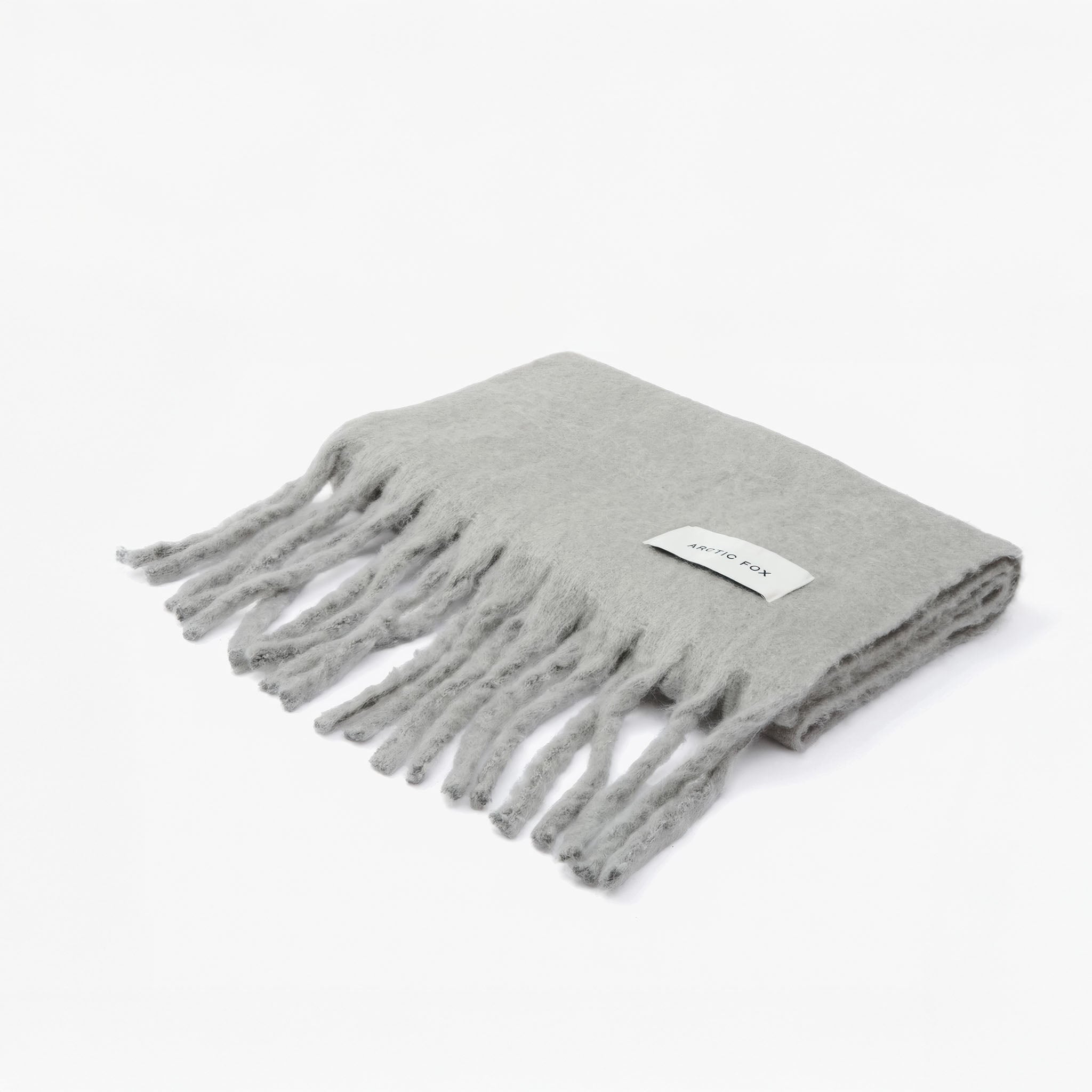 Folded grey scarf with fringes and branded logo Arctic Fox on a white background