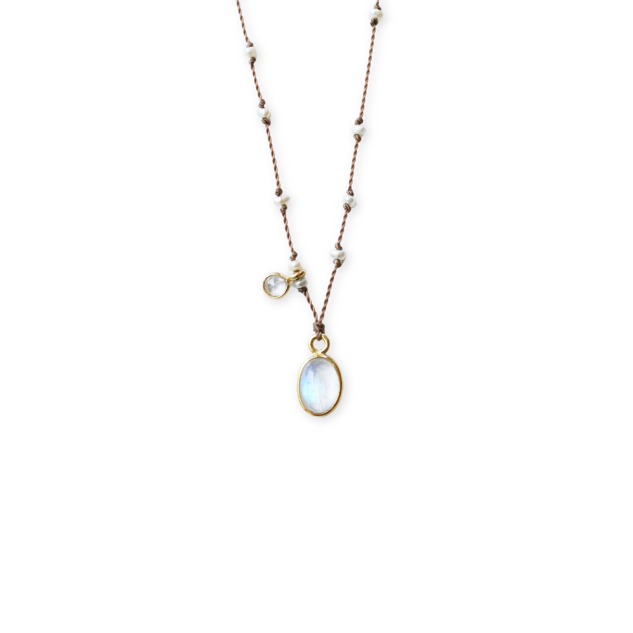 Close up of See Real Flowers You and Me Necklace w/ Rainbow Moonstone on a white background