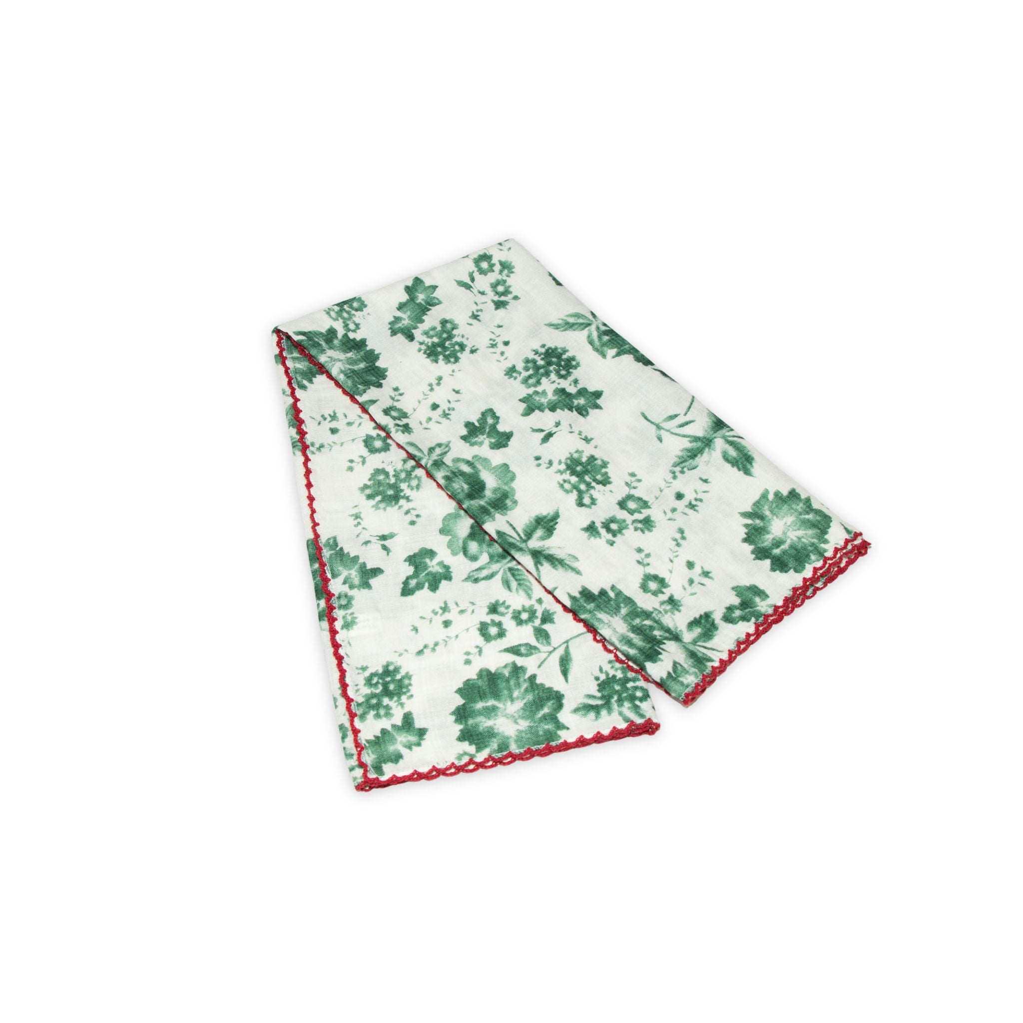 Floral patterned scarf on a white background with faded green and deep red colors prominent