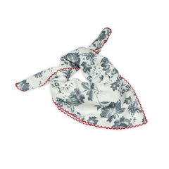 Floral patterned scarf on a white background with faded blue and deep red colors prominent