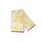 Floral patterned scarf on a white background with faded yellow and deep red colors prominent