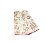 Floral patterned scarf on a white background with light brown and deep red colors prominent