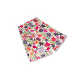 Floral patterned scarf on a white background with bright pink and lavender colors prominent