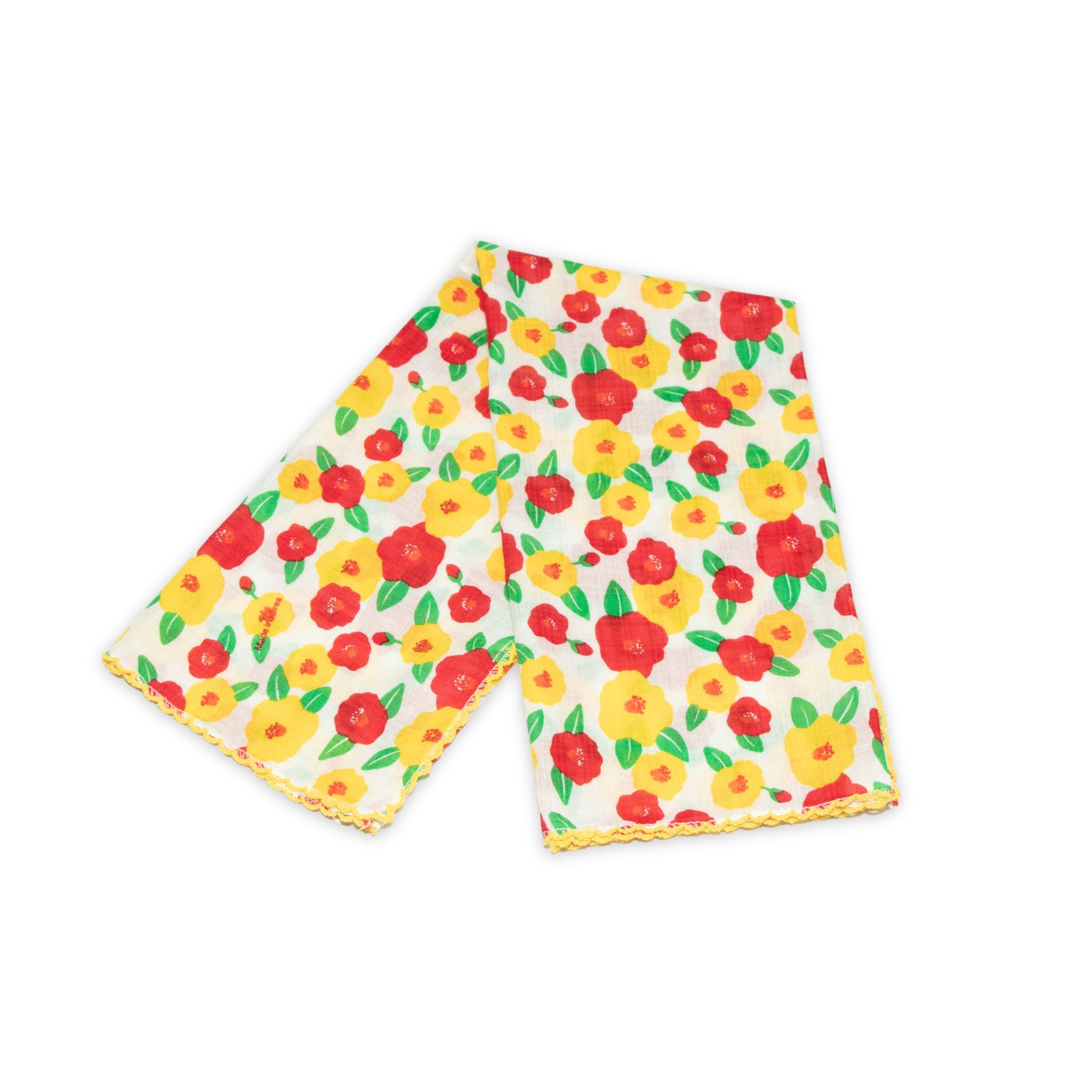 Floral patterned scarf on a white background with red and yellow colors prominent