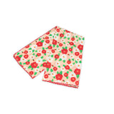 Floral patterned scarf on a white background with red and peach colors prominent