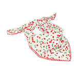 Cherry patterned scarf on a white background with red and white colors prominent