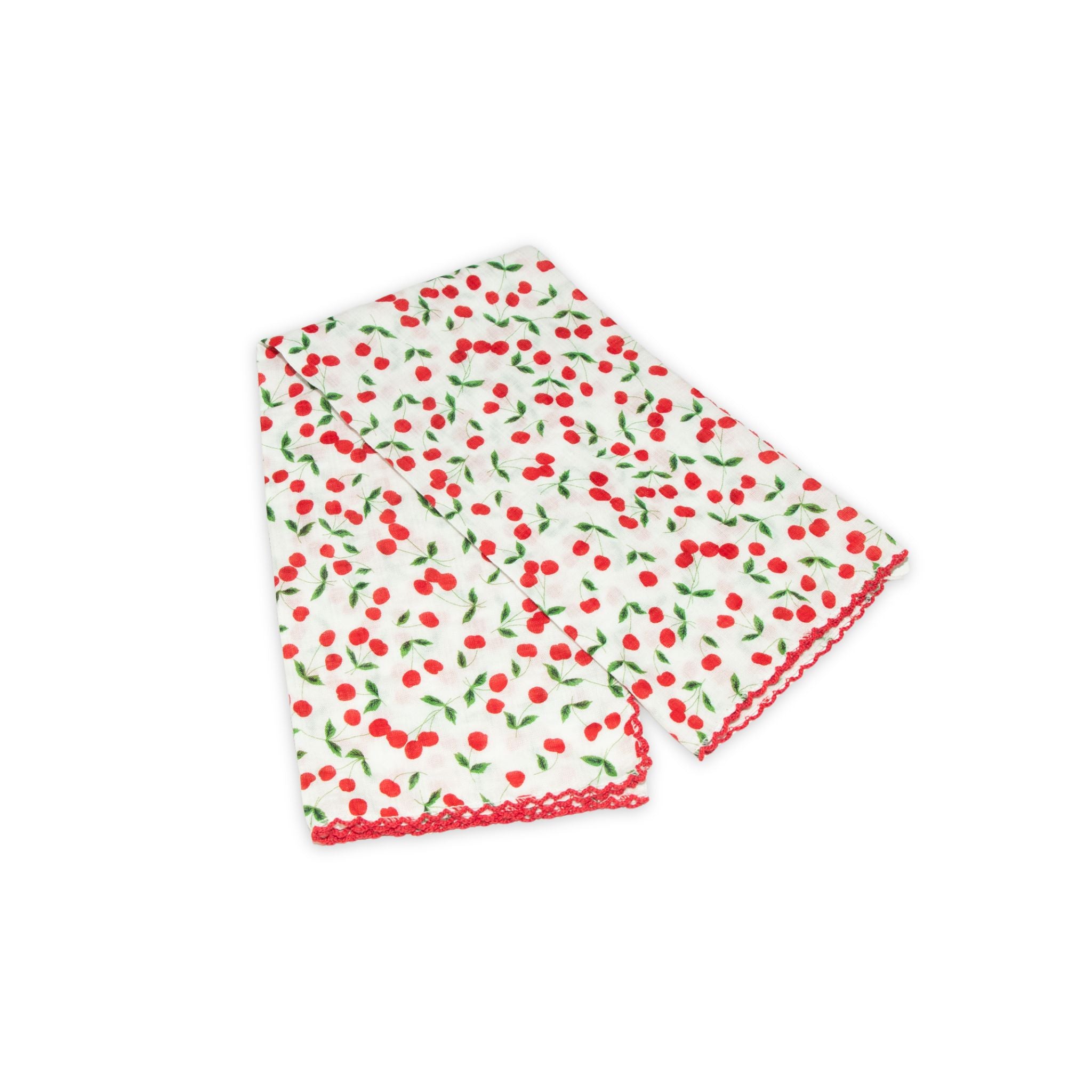 Cherry patterned scarf on a white background with red and white colors prominent