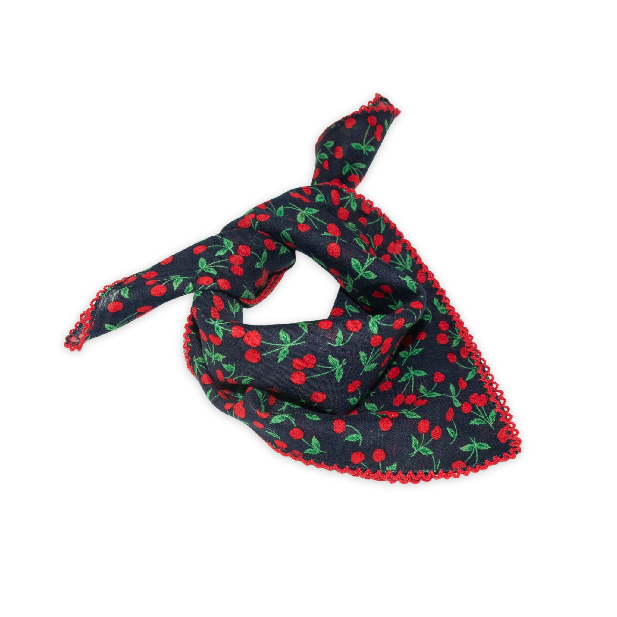 Cherry patterned scarf on a white background with red and dark denim navy colors prominent