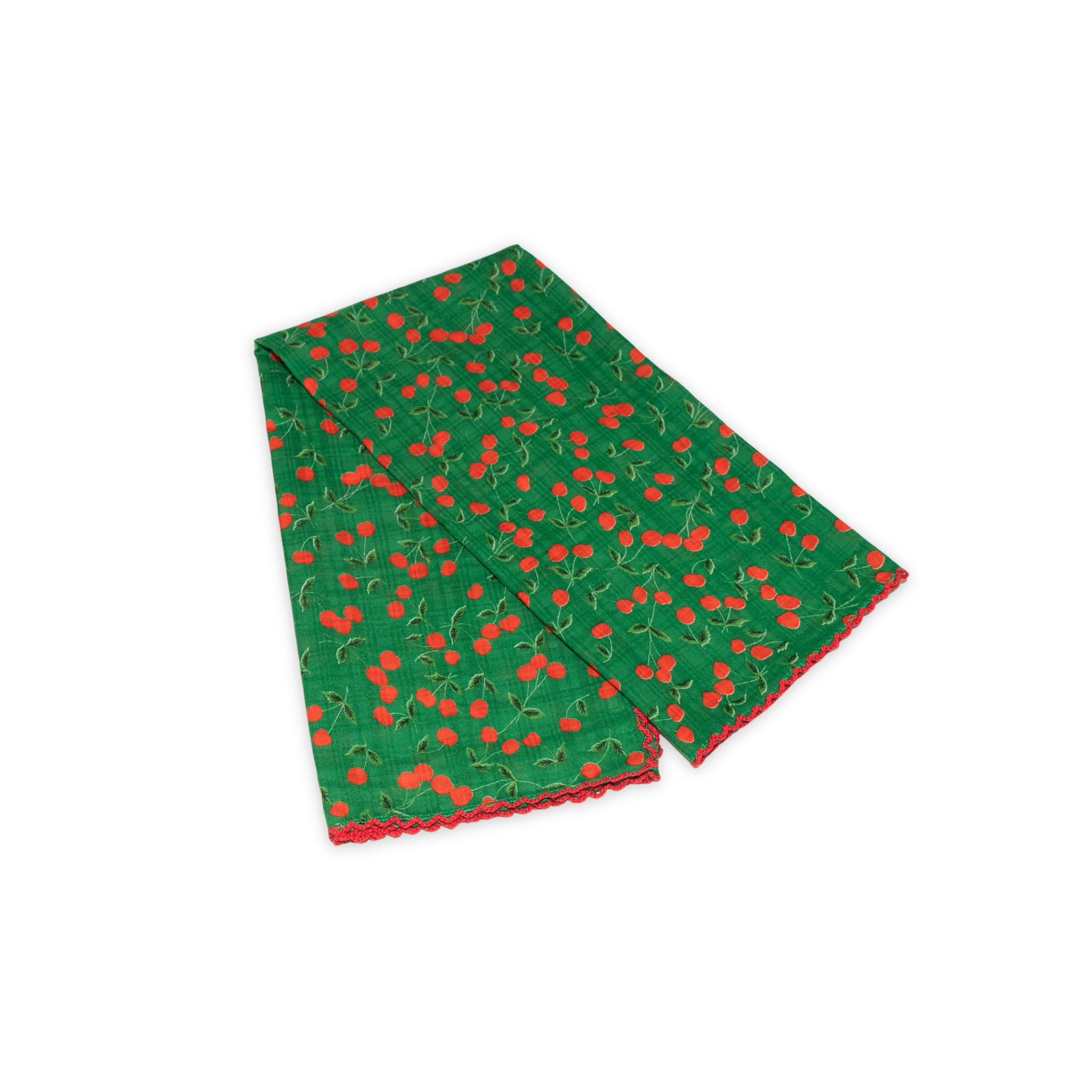 Cherry patterned scarf on a white background with red and deep green colors prominent