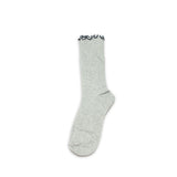 Gray sock with black lace trim on a white background