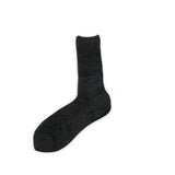 Black shiny sparkling sock on a white background
