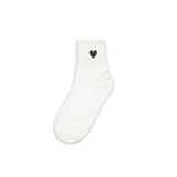 White sock with a black heart design on a white background
