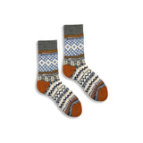 Pair of patterned socks with brown accents on a white background