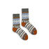 Pair of patterned socks with brown accents on a white background